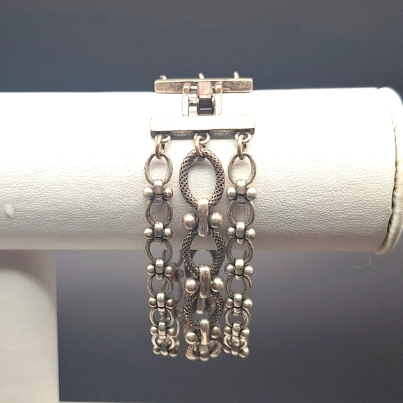 Three strand silver tone bracelet with fold-over clasp, 6.75" - Picture 2 of 2